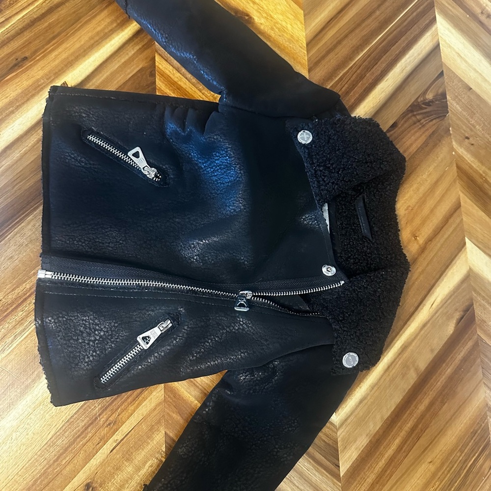 Black Leather Motorcycle Jacket with Silver Zippers